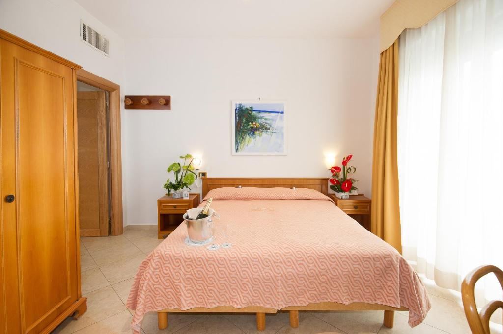 Postel nebo postele na pokoji v ubytování Joli Park Hotel - Caroli Hotels