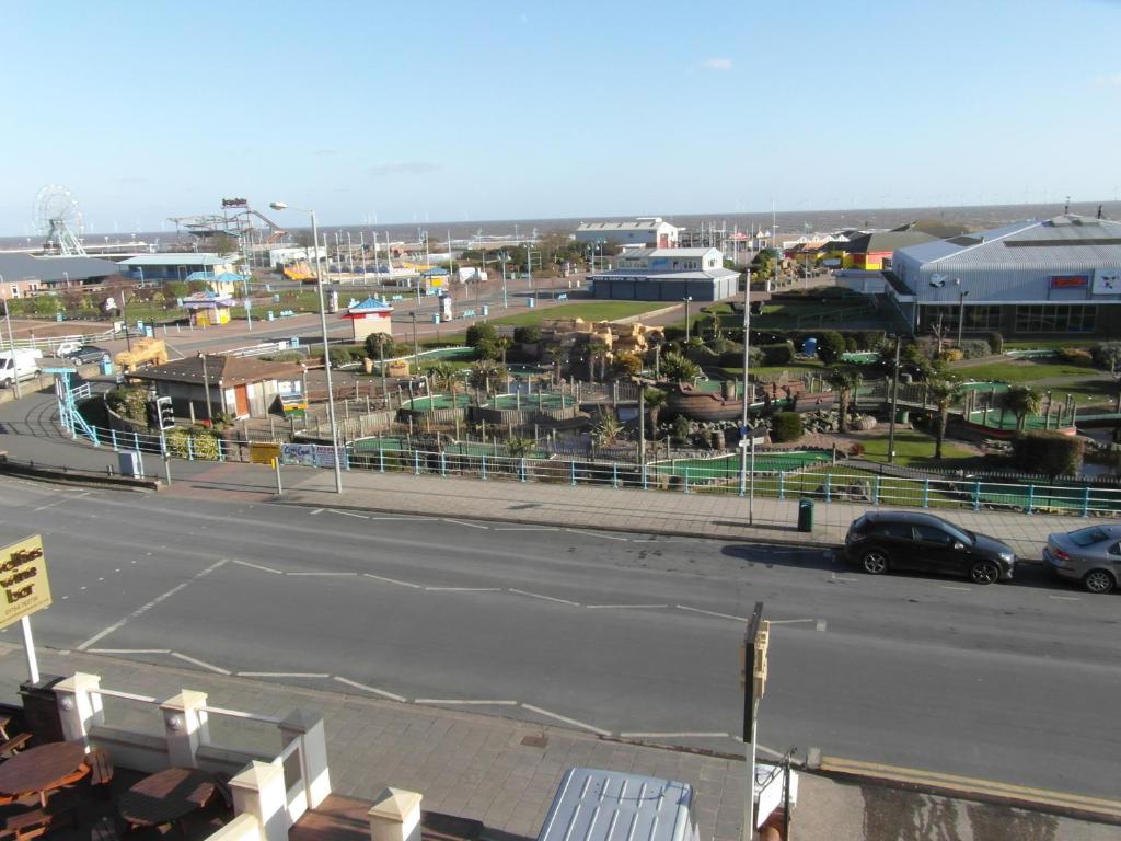 a view of a street with a parking lot at Greystones in Skegness
