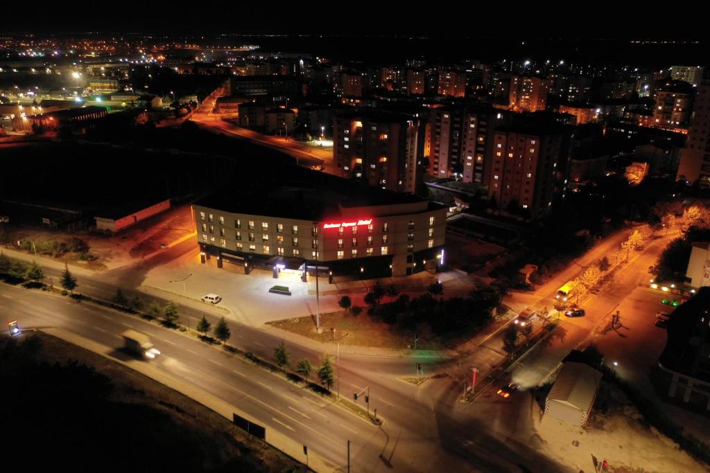 an aerial view of a city at night at BUSINESS EXPRESS HOTEL in Kapaklı
