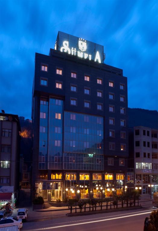 a building with a sign on the top of it at Büyük Sümela Otel in Macka