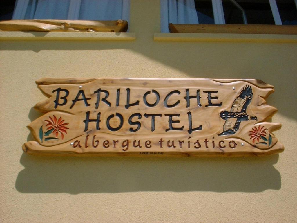 a sign on the side of a building at Bariloche Hostel in San Carlos de Bariloche