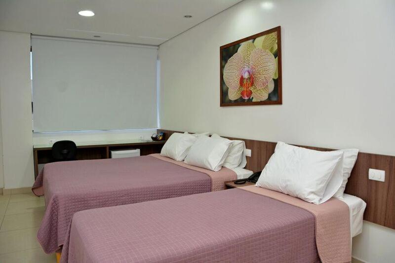 Lis Hotel tesisinde bir odada yatak veya yataklar