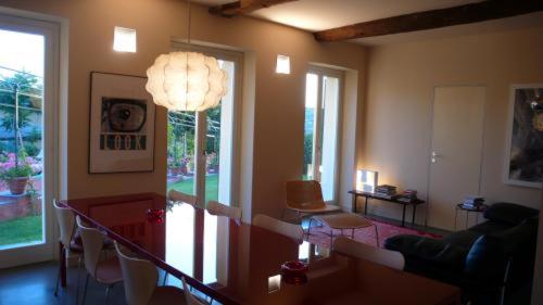 a living room with a chandelier in the middle of a room at Villa Rosmarino in Camogli