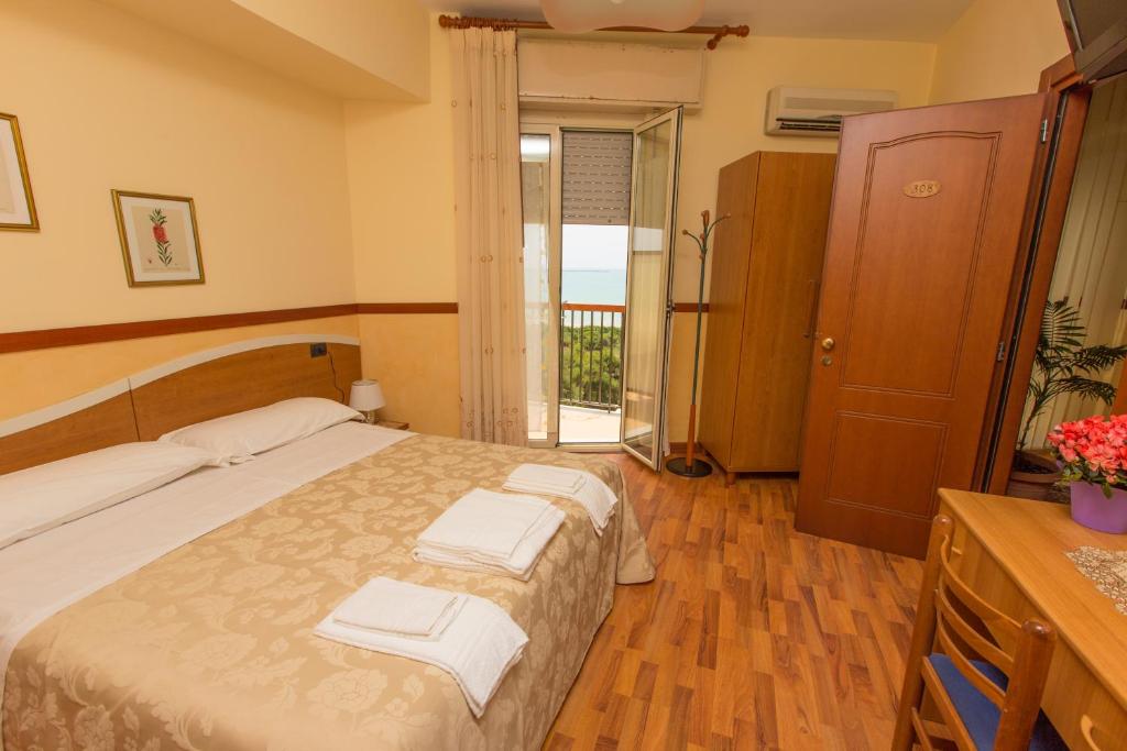 Posteľ alebo postele v izbe v ubytovaní Hotel Sole