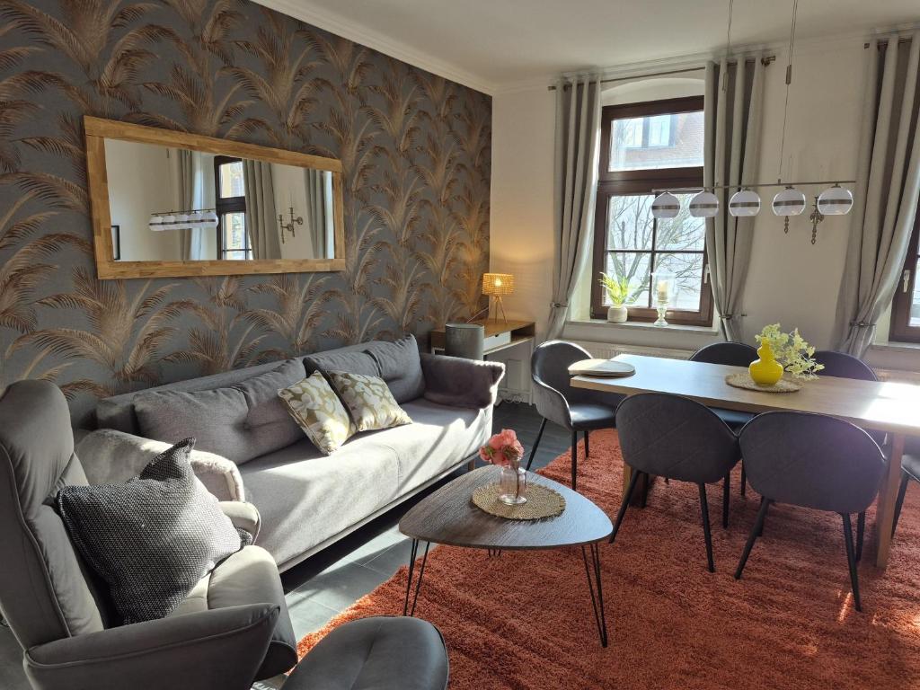 a living room with a couch and a table at City-Apartment 1 in Bernburg