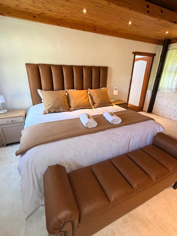 a large bed with two towels on top of it at Bed In Bethlehem in Bethlehem