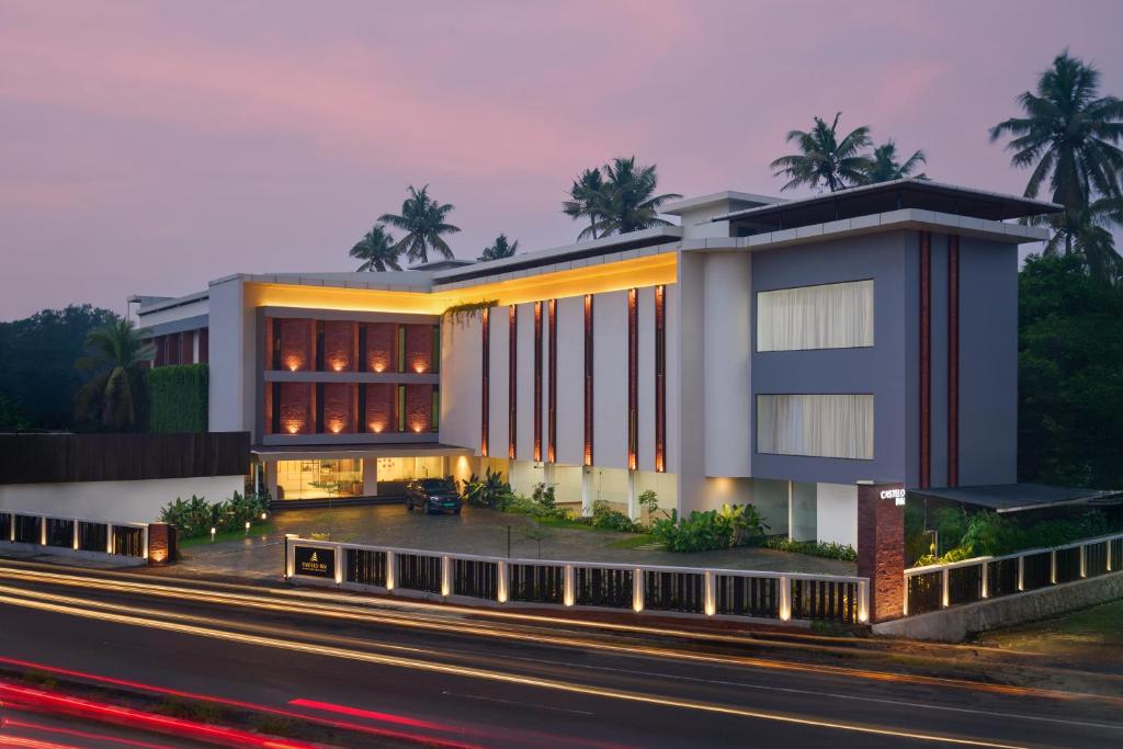 a building on the side of a road at CASTELO Inn in Nedumbassery