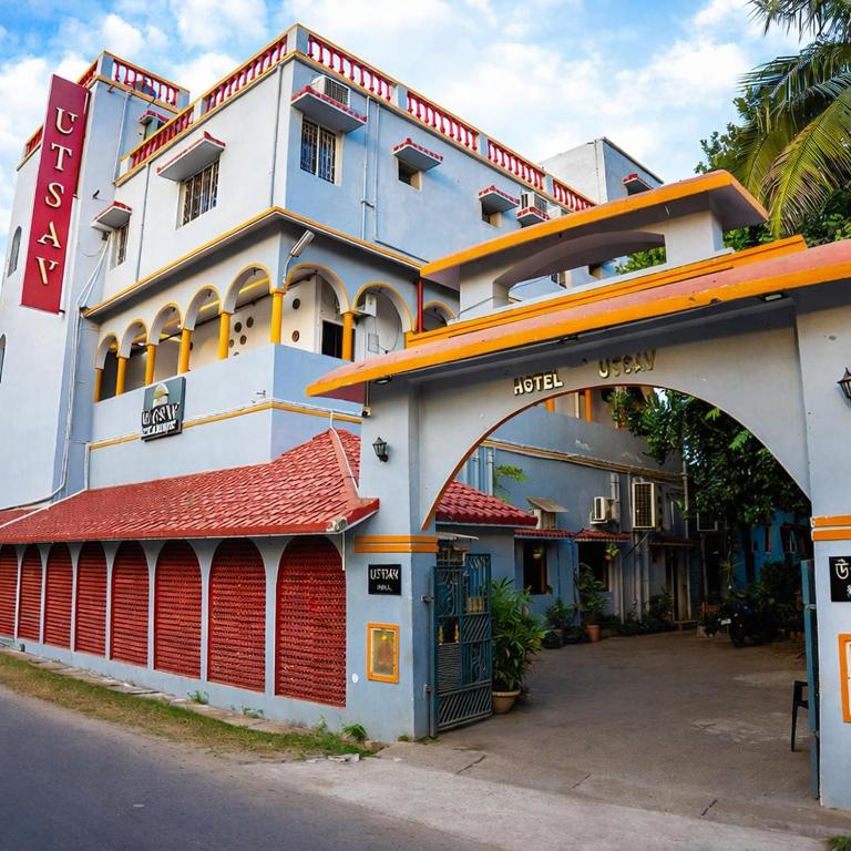 a building with an arch in front of it at Utsav Hotels and Banquets Bolpur, Shantiniketan in Bolpur