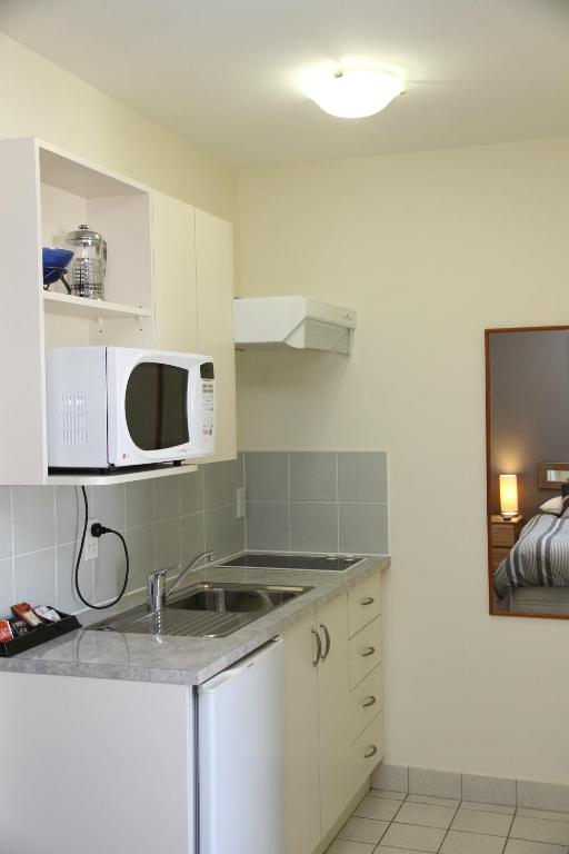 Kuchyň nebo kuchyňský kout v ubytování Brinkley Resort