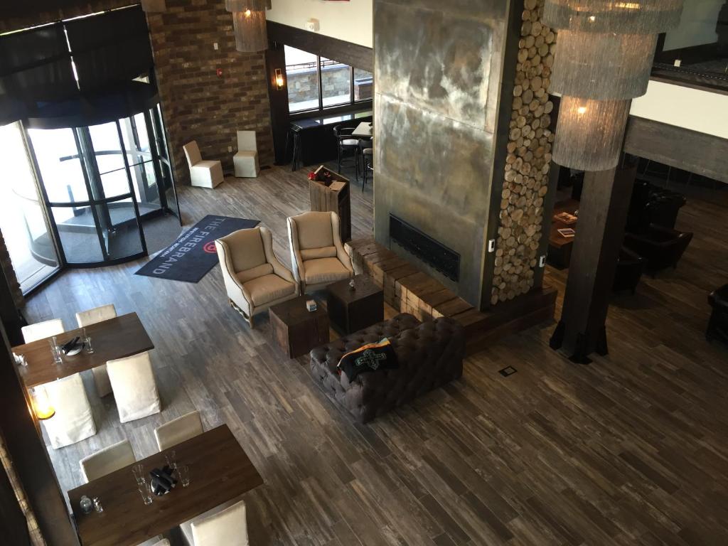 an overhead view of a lobby with chairs and a fireplace at Firebrand Hotel in Whitefish