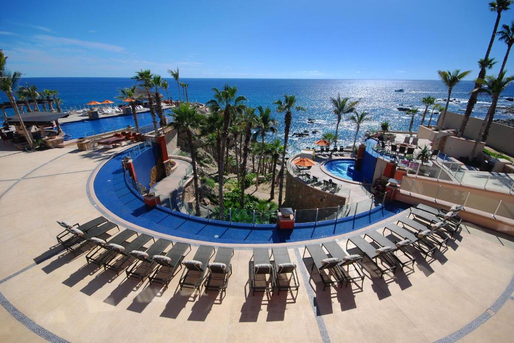 an aerial view of a resort with chairs and a pool at Hyatt Vacation Club at Sirena del Mar in Cabo San Lucas