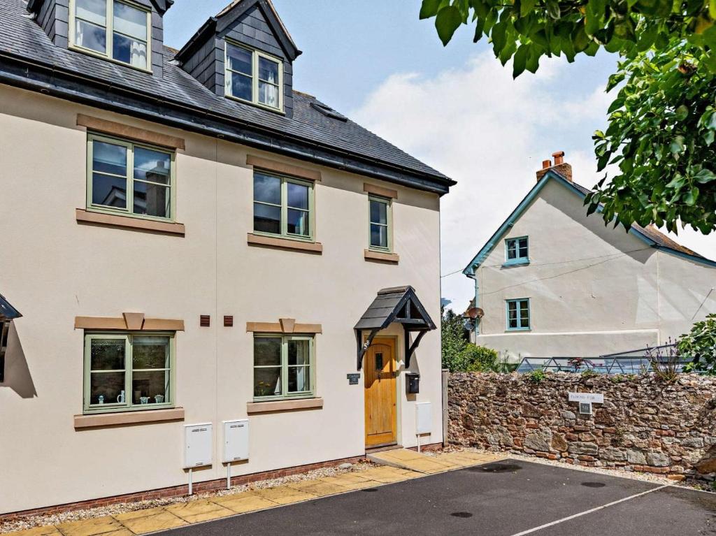 a large white house with a stone wall at 3 Bed in Watchet oc-83532 in Watchet