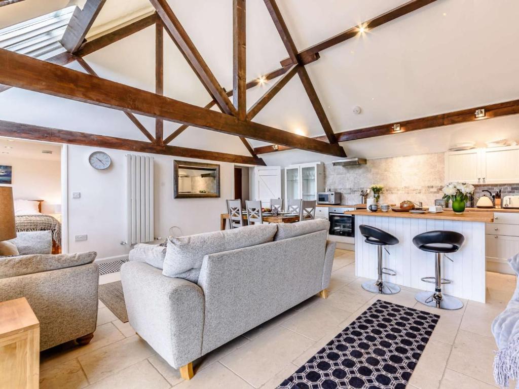 a living room with a couch and a kitchen at 3 Bed in Chippenham oc-77334 in Chippenham