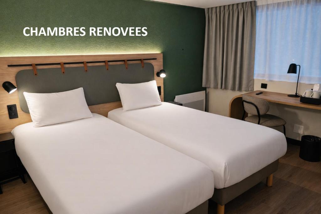 a hotel room with two beds and a desk at Campanile Lille Sud - Douai Cuincy in Cuincy