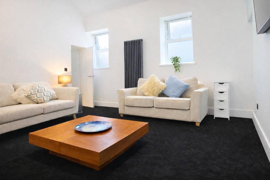 a living room with two couches and a coffee table at The Croft in Ramsey