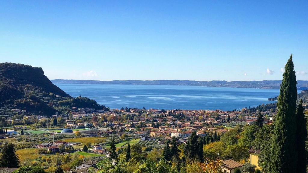 a view of a town and a body of water at Villa Belvedere Liberty in Costermano