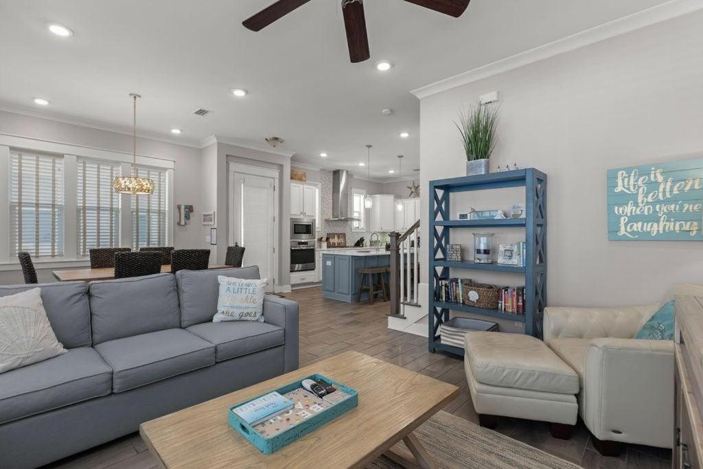 a living room with a couch and a table at Sea Haven At Prominence in Watersound Beach