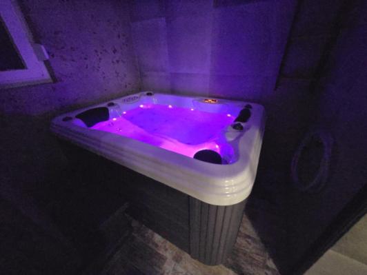 a purple bath tub with a purple lighting in a bathroom at Bella Vista in Stažnjevci