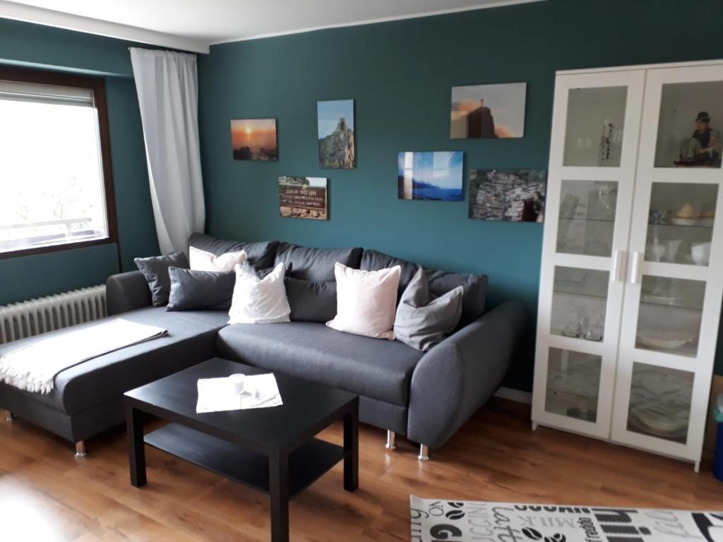a living room with a couch and a table at FeWo Edelweiß Jäger in Nesselwang