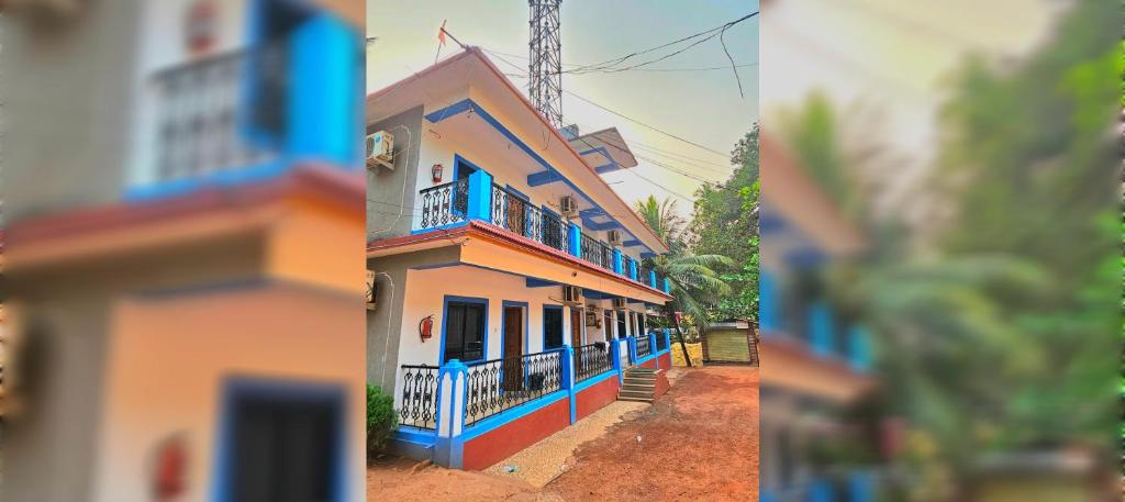 two pictures of a house with blue and orange trim at Saligao Inn Apartment's in Saligao