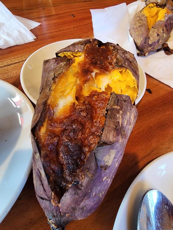 a roasted eggplant on a plate on a table at Coffee Myhome in Xuan An