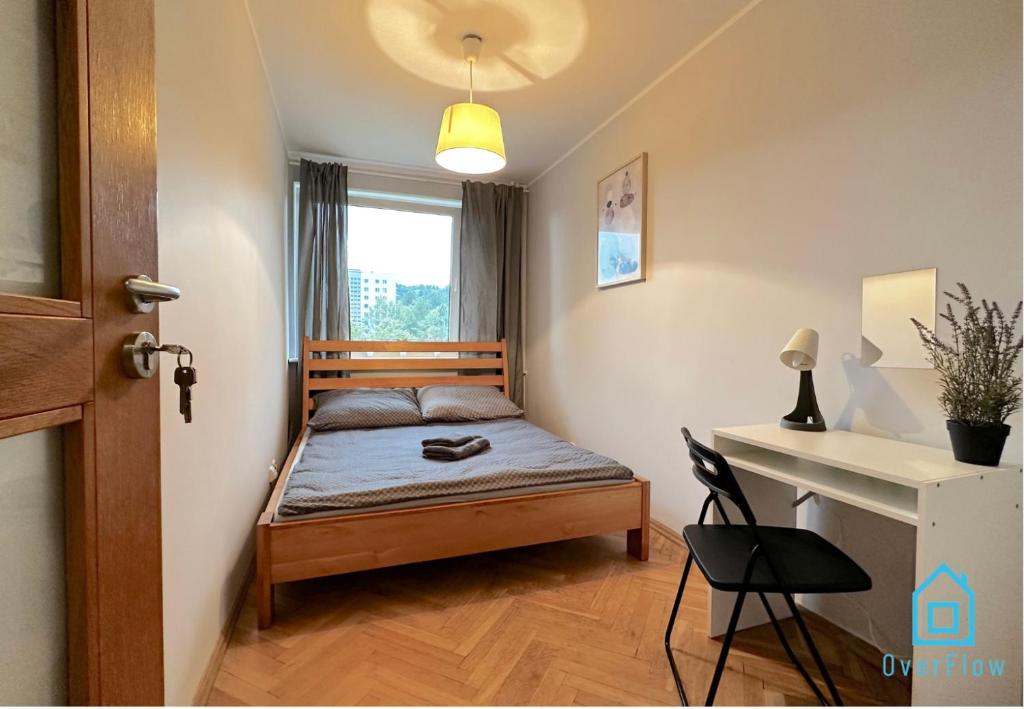 a small bedroom with a bed and a desk at Balance Room - 5 Minutes to Sopot Molo & Seaside in Sopot