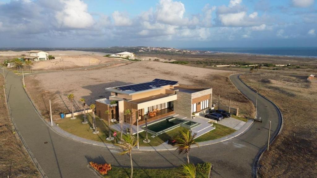 an aerial view of a house with the ocean at Casa riviera in Aquiraz