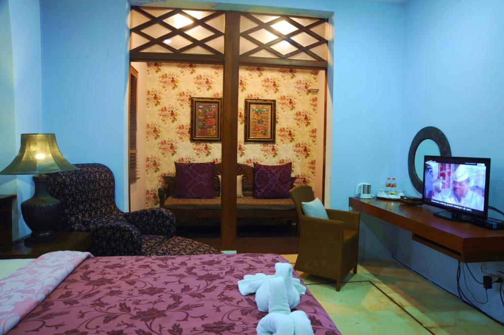 TV a/nebo společenská místnost v ubytování Tegal Panggung Guest House