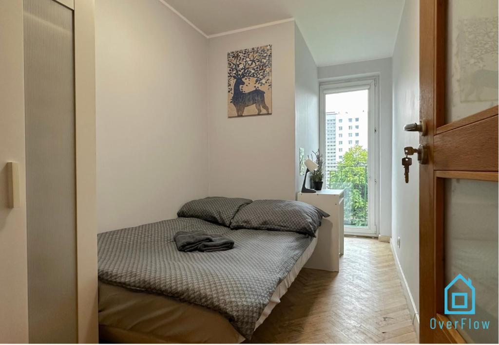 a bedroom with two beds in a room with a window at Elk Room - 5 Minutes to Sopot Molo & Seaside in Sopot