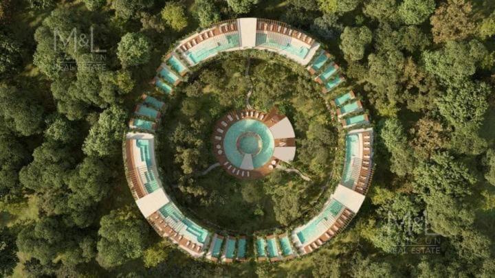 an aerial view of a building in the middle of a forest at Alof Studio in the Jungle in Tulum