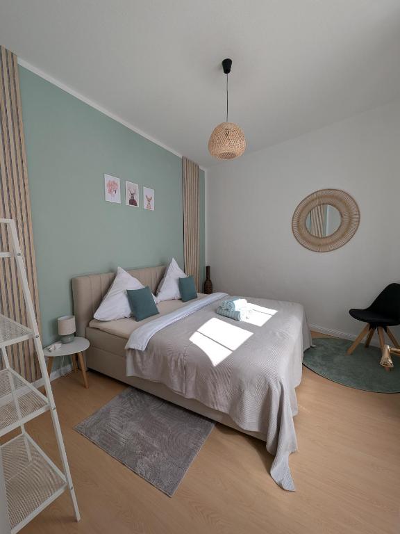 a bedroom with a large bed and a ladder at Appartement Napoleon in Meißen