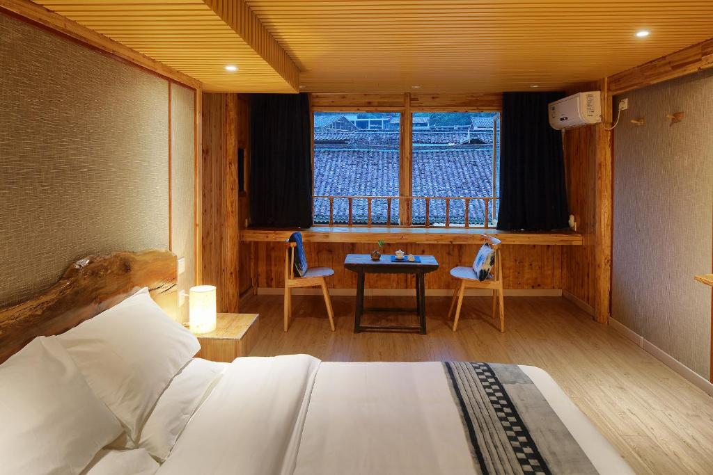 Postel nebo postele na pokoji v ubytování Tong Sang Art Hotel