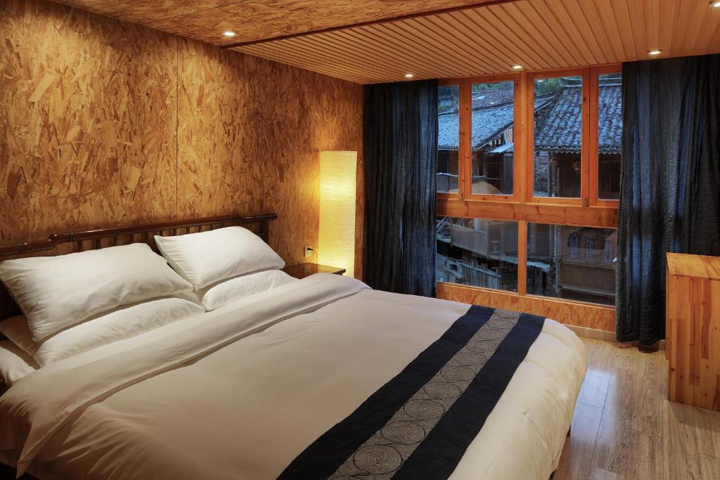 Postel nebo postele na pokoji v ubytování Tong Sang Art Hotel