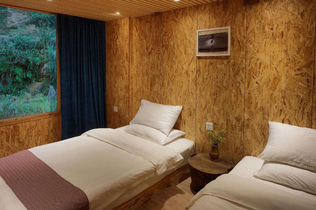 Postel nebo postele na pokoji v ubytování Tong Sang Art Hotel