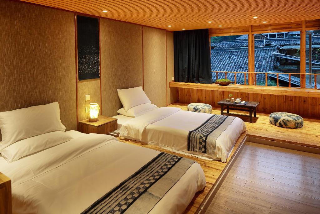 Postel nebo postele na pokoji v ubytování Tong Sang Art Hotel