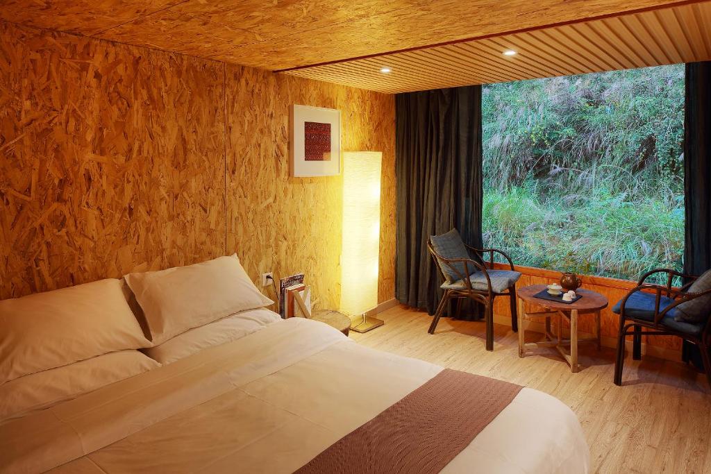 Postel nebo postele na pokoji v ubytování Tong Sang Art Hotel