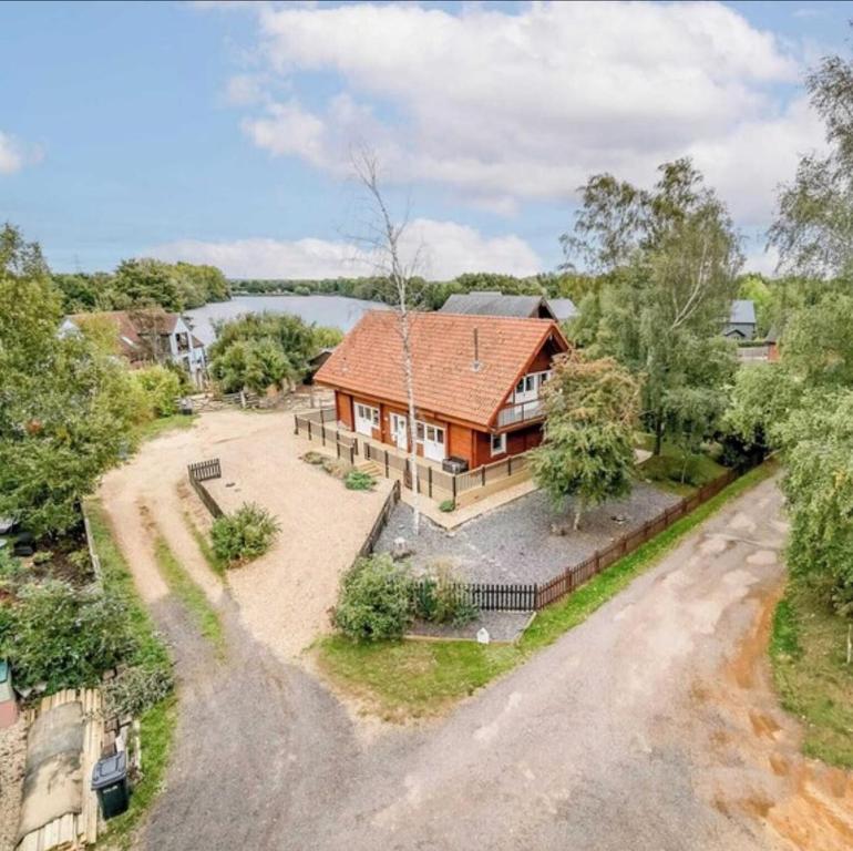 an aerial view of a house with a yard at Alpine Lodge in Pentney