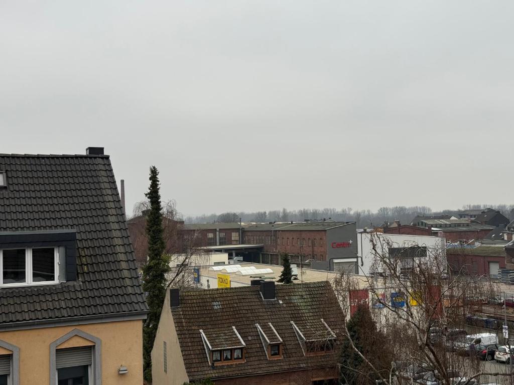 a view of roofs of buildings in a city at Duren Bahnhof in Düren - Eifel