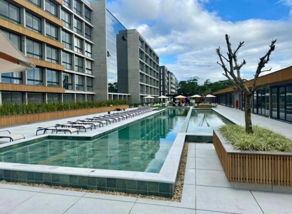 a pool in the middle of a building at Livin517 in Xangri-lá