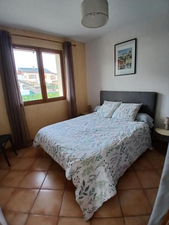a bedroom with a bed and a window at Alby in Alby