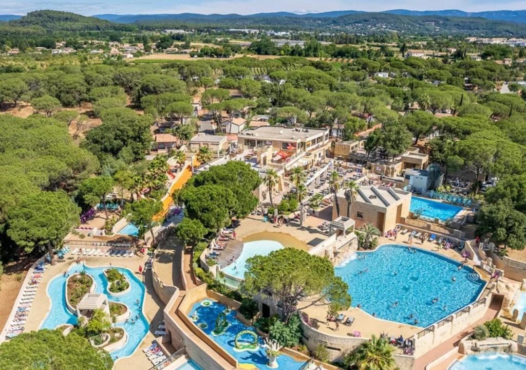 an aerial view of a resort with two pools at Camping Les Cigales - Aquatique Vacances in Le Muy