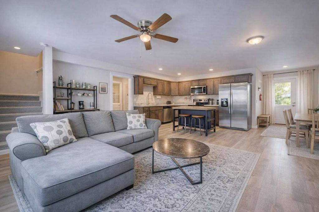 a living room with a couch and a ceiling fan at Mountain View Haven in Belgrade in Belgrade