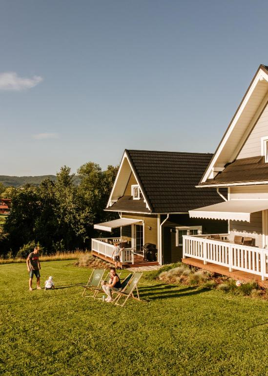 a group of people playing in the yard of a house at Domki Dobre Miejsce in Rabka-Zdrój