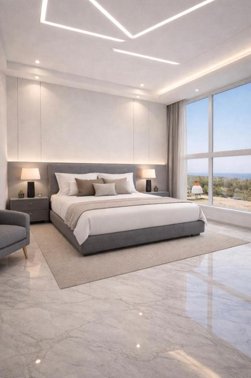 a bedroom with a large bed and a large window at Malaga palace in Soûr