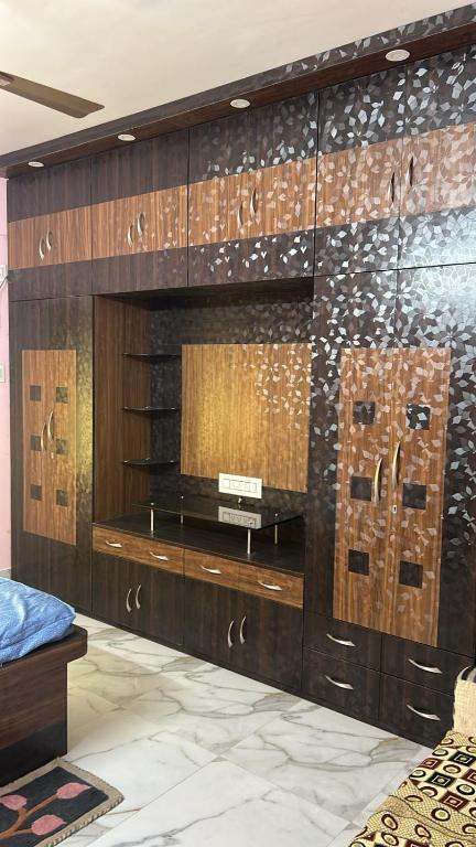 a room with a wall with wood paneling at Apartment in Khardaha in Khardah