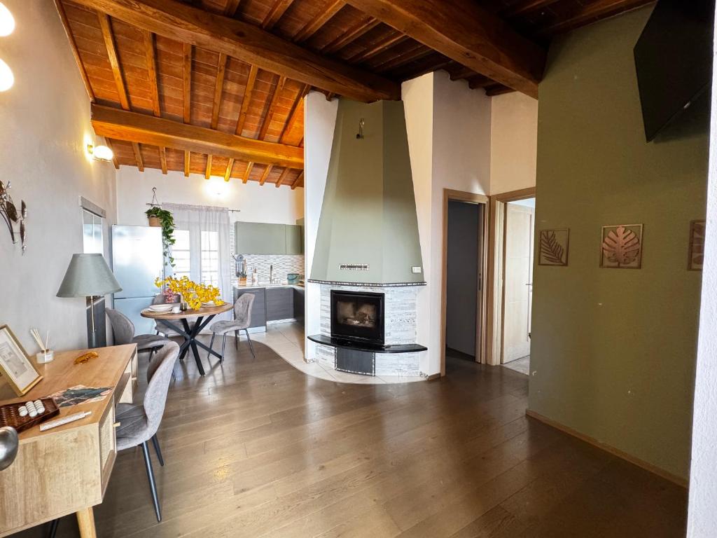 a living room with a fireplace in the middle of a room at La Casa di Thor in Porto Azzurro