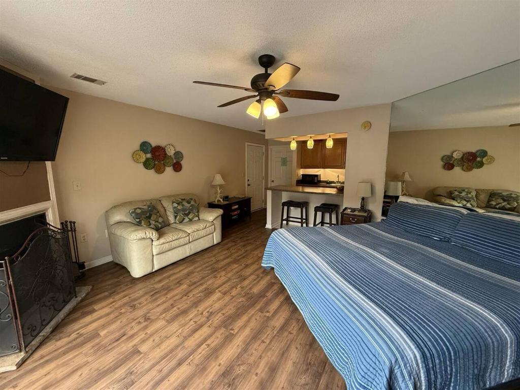 a bedroom with a bed and a ceiling fan at Rivers Edge 803c in Helen