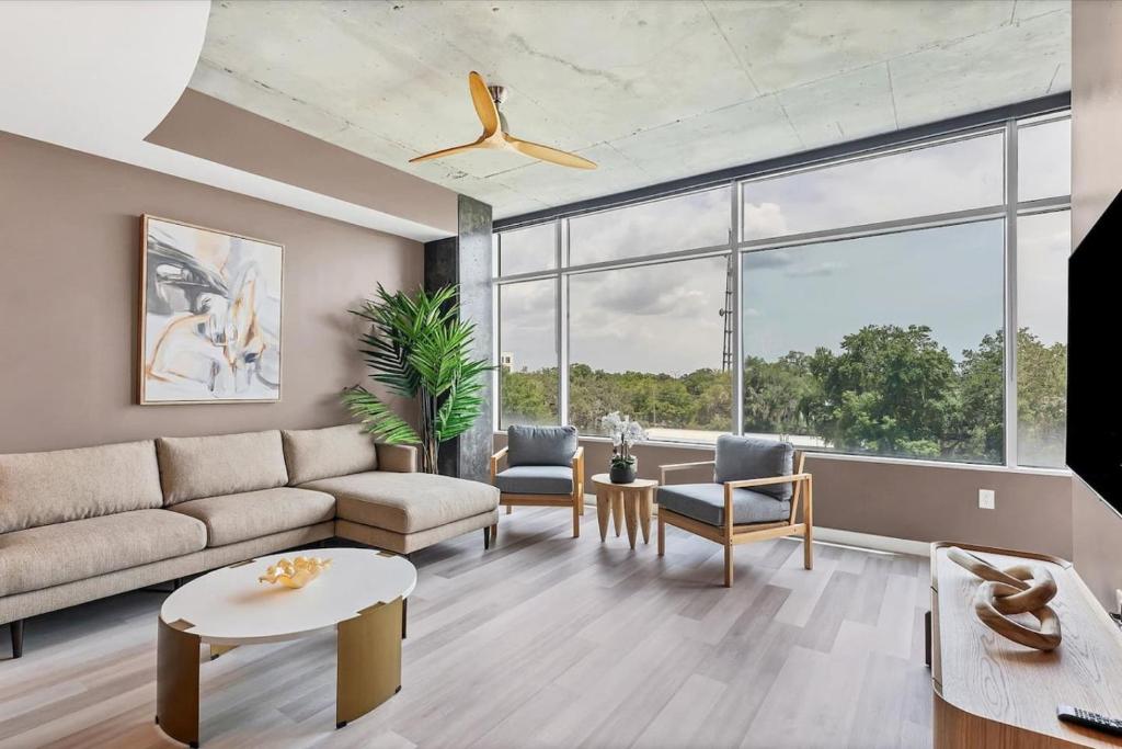 a living room with a couch and a table at Spacious Apartment Masterfully Decorated in Orlando