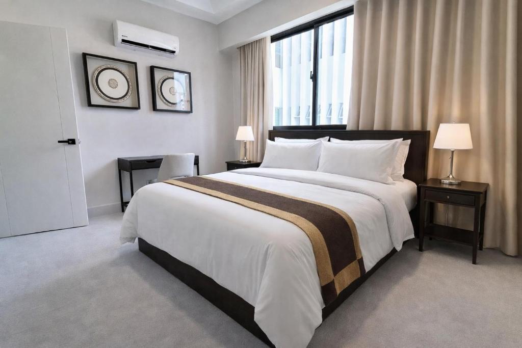 a bedroom with a large bed and a large window at 1B in Naco Jacuzzi very Centric in Santo Domingo