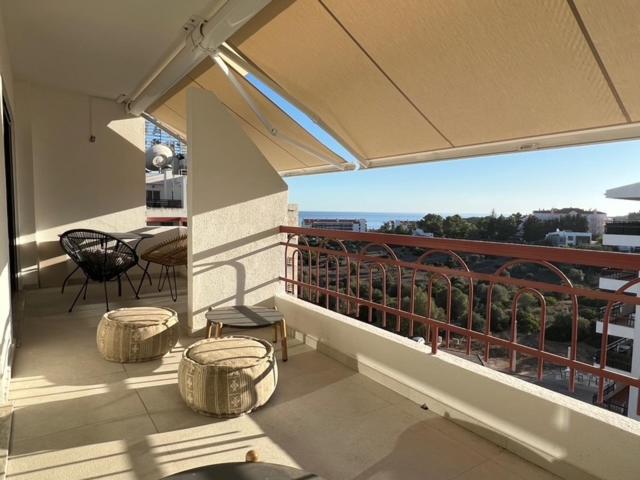 a balcony with a table and chairs on a balcony at Francisco Vau Apartment in Portimão
